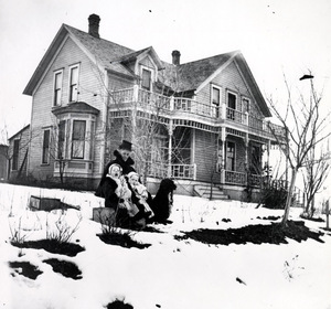 Image of Mrs. McCallie, Annette and Horton McCallie in front of Dr. John Hugh McCallie home. Moscow, Idaho.